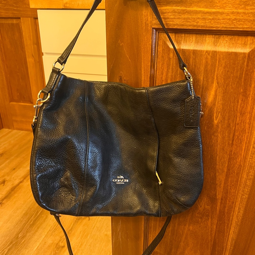 Black Coach pebbled leather crossbody bag.